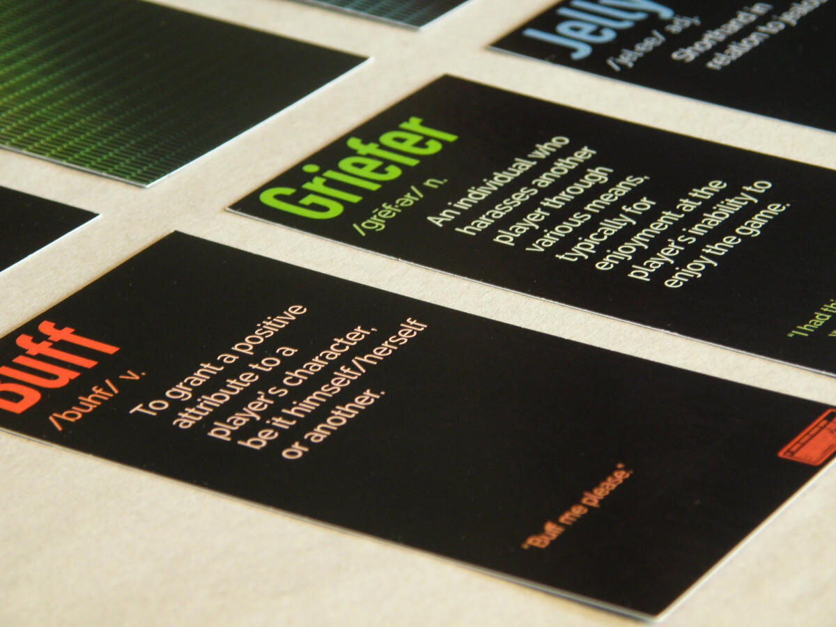 Gamer Speak cards fanned out showing close-up detail of the typography and definition layout.