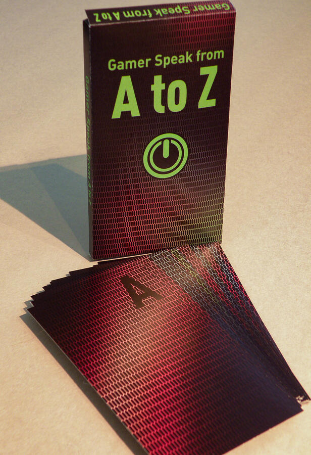 Gamer Speak from A to Z card set showing the box packaging and card backs with RGB pixel grid texture.
