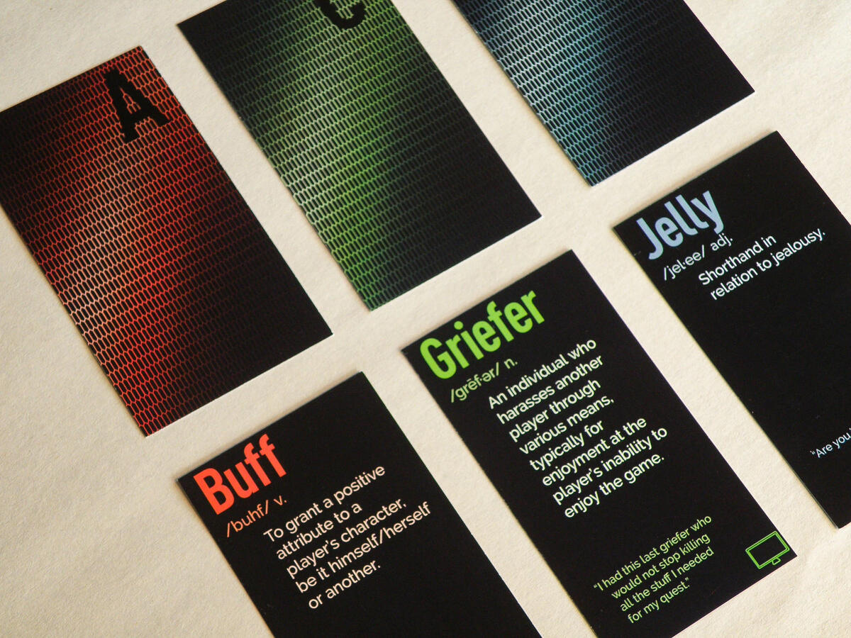 Gamer Speak card fronts showing gaming terminology definitions with RGB color-coded typography.
