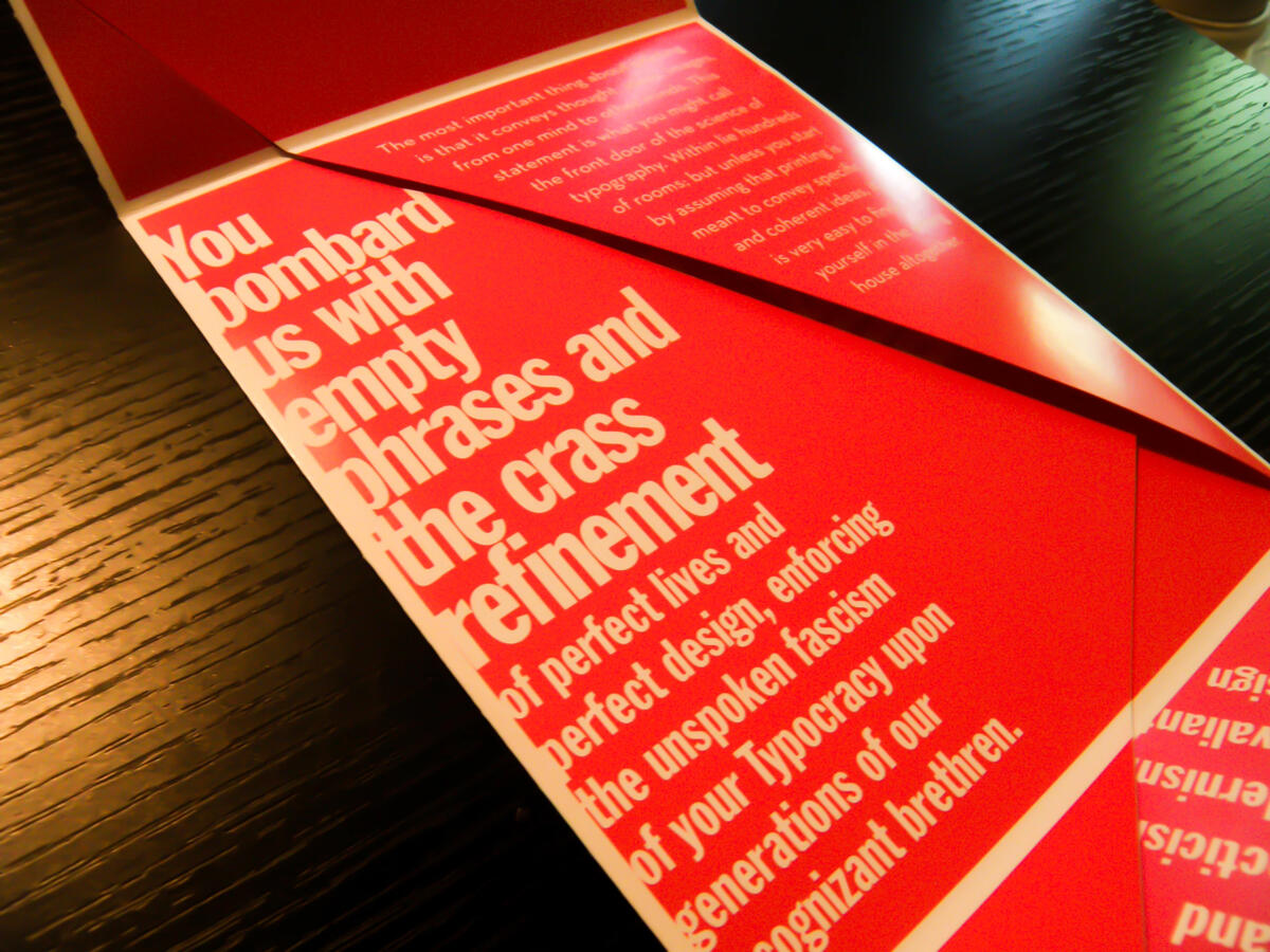A Crystal Goblet pamphlet unfolded showing aggressive typographic layout on red.