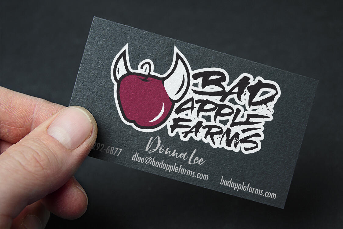 Bad Apple Farms logo printed on a business card mockup.